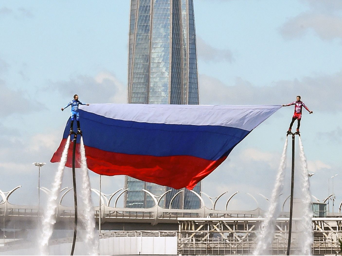 Russian hydroflight team hold the Russian national flag during the Russia Day celebration Photo Gallery - Sakshi4