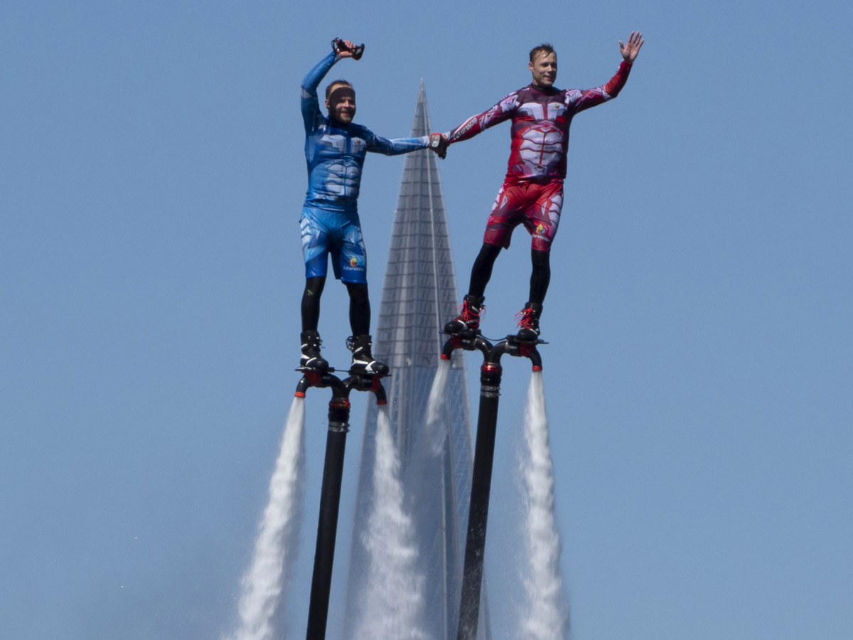 Russian hydroflight team hold the Russian national flag during the Russia Day celebration Photo Gallery - Sakshi5