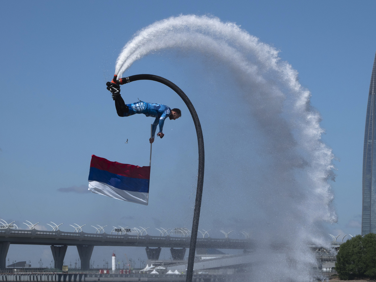 Russian hydroflight team hold the Russian national flag during the Russia Day celebration Photo Gallery - Sakshi6