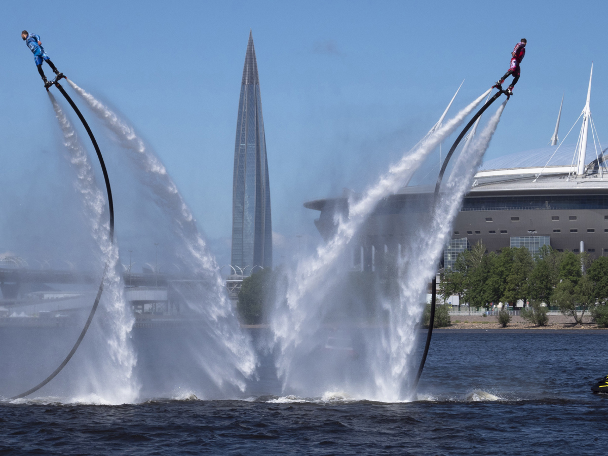 Russian hydroflight team hold the Russian national flag during the Russia Day celebration Photo Gallery - Sakshi1