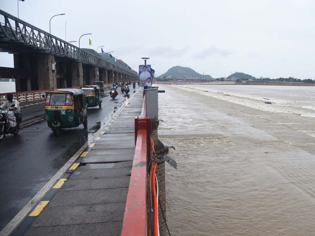 Prakasam Barrage 60 Gates Lifted In Krishna District - Sakshi14