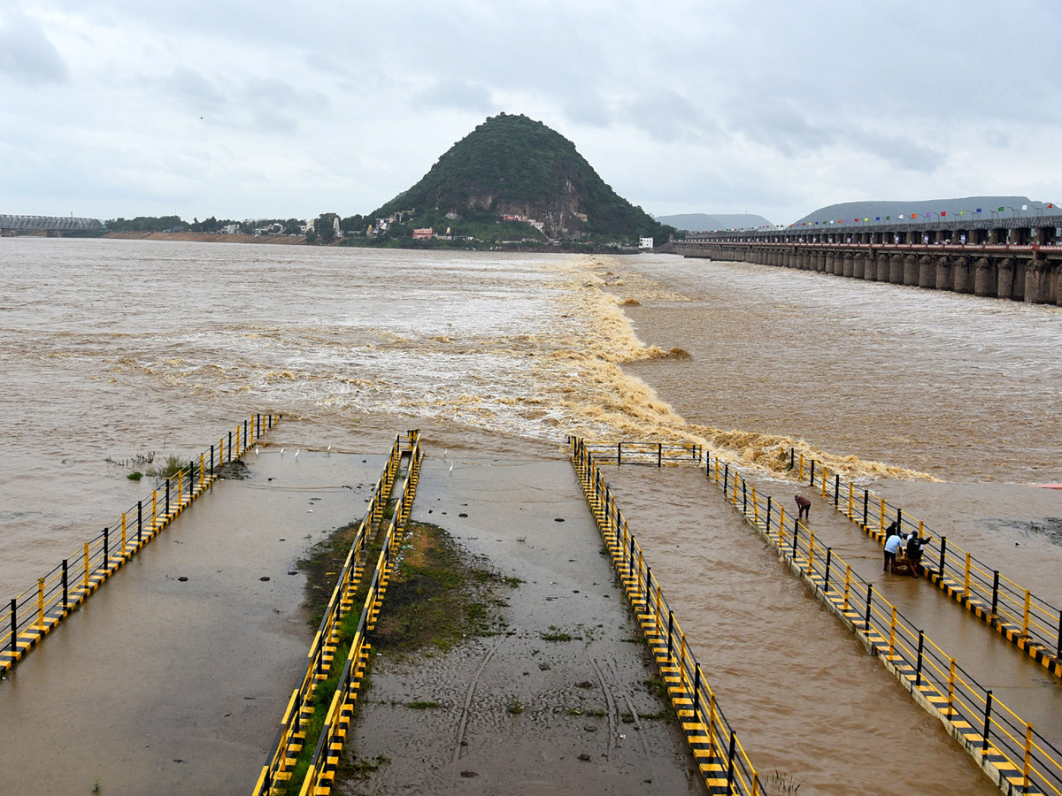 heavy water inflow krishna rivers vijayawada  - Sakshi11