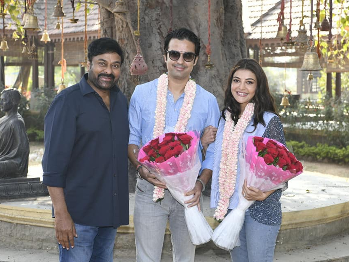 Kajal Agarwal Gautam Kitchlu Meets Chiranjeevi Acharya Sets - Sakshi2