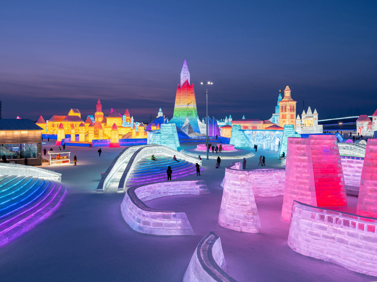 China: People take photos in front of ice sculptures at the Harbin Ice and Snow Festival - Sakshi10