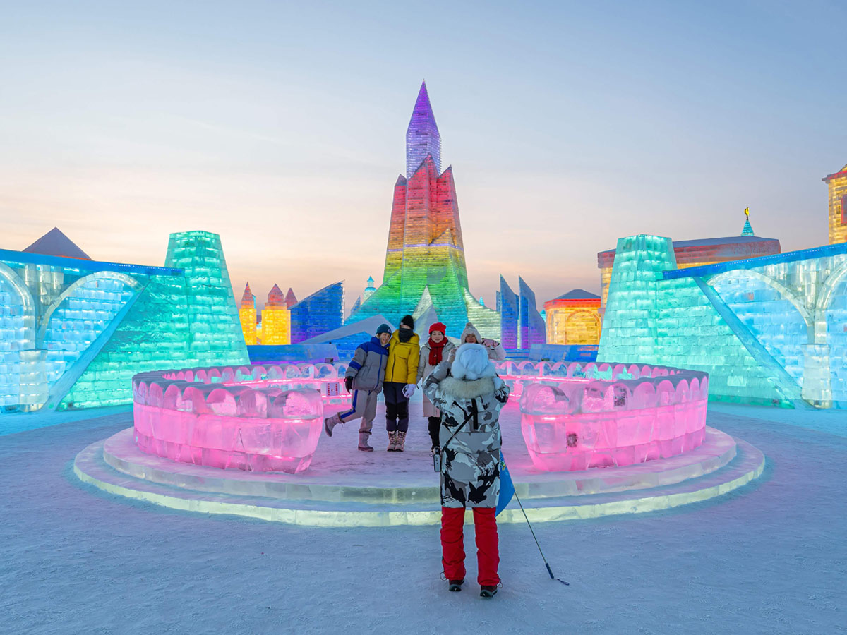 China: People take photos in front of ice sculptures at the Harbin Ice and Snow Festival - Sakshi11