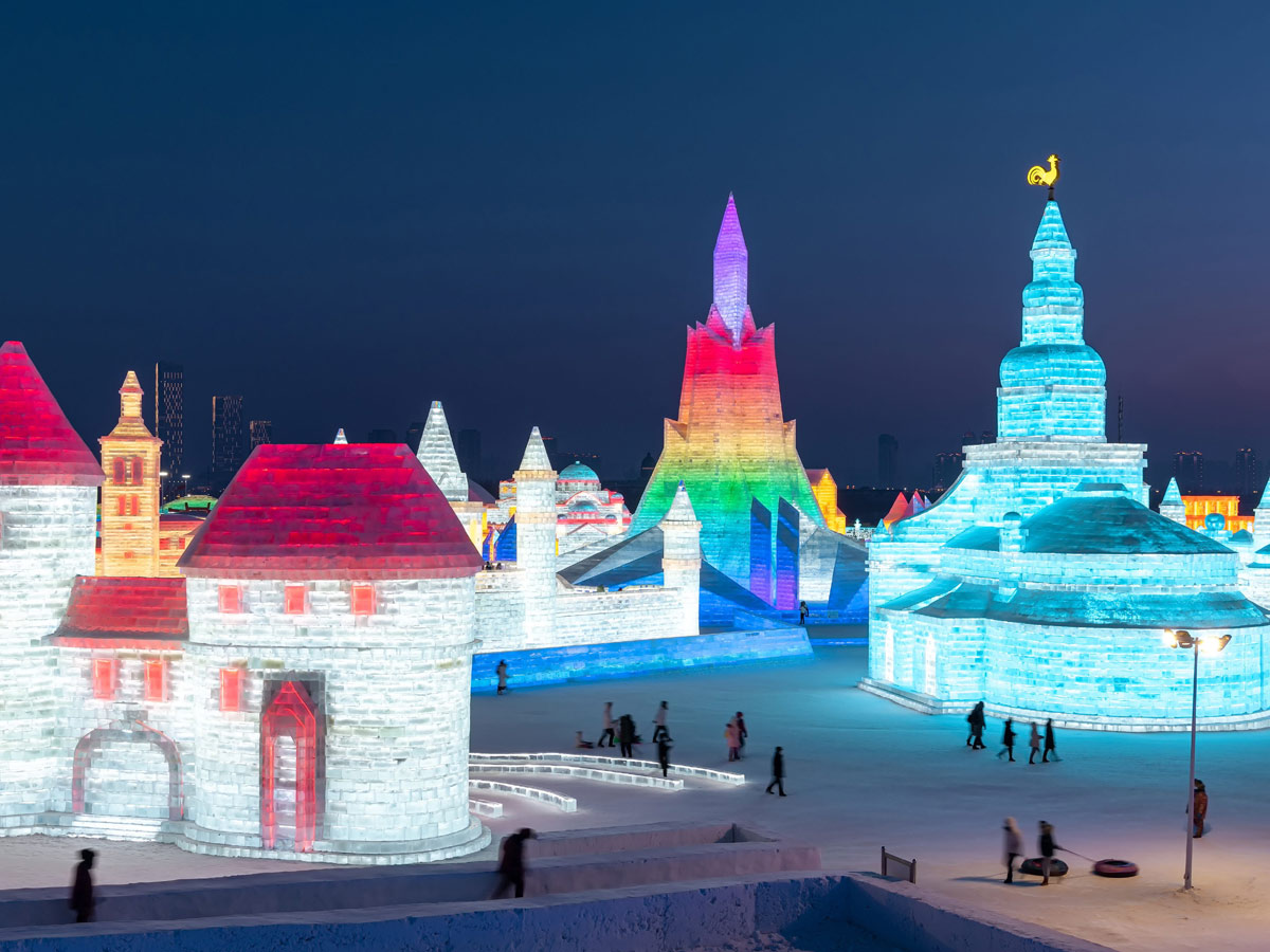 China: People take photos in front of ice sculptures at the Harbin Ice and Snow Festival - Sakshi12