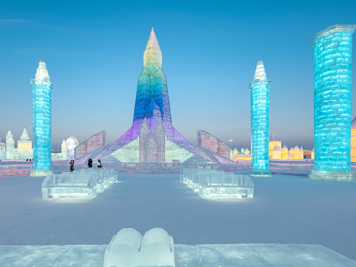 China: People take photos in front of ice sculptures at the Harbin Ice and Snow Festival - Sakshi3