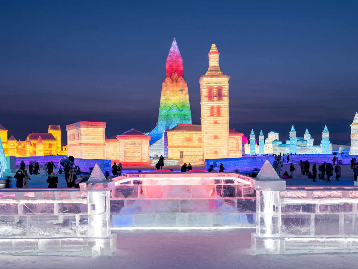 China: People take photos in front of ice sculptures at the Harbin Ice and Snow Festival - Sakshi5