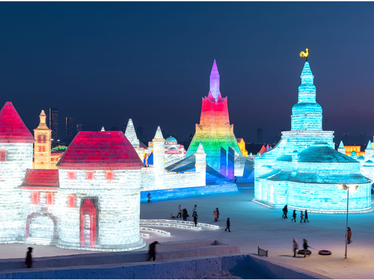 China: People take photos in front of ice sculptures at the Harbin Ice and Snow Festival - Sakshi6