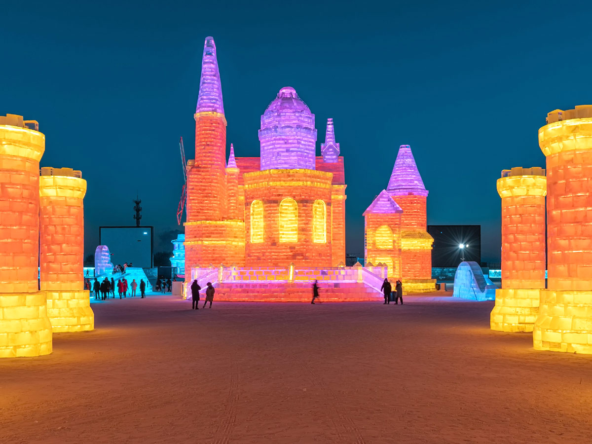 China: People take photos in front of ice sculptures at the Harbin Ice and Snow Festival - Sakshi7