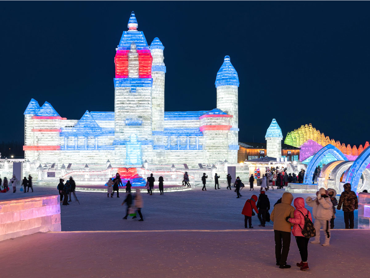 China: People take photos in front of ice sculptures at the Harbin Ice and Snow Festival - Sakshi1