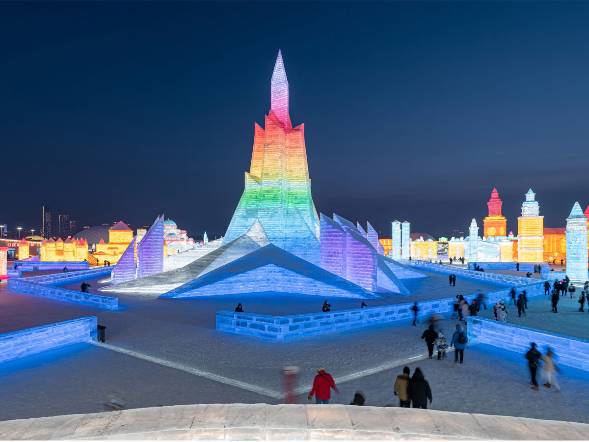 China: People take photos in front of ice sculptures at the Harbin Ice and Snow Festival - Sakshi8