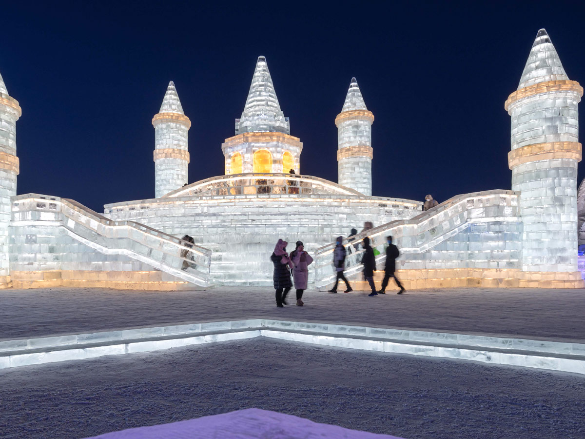 China: People take photos in front of ice sculptures at the Harbin Ice and Snow Festival - Sakshi9