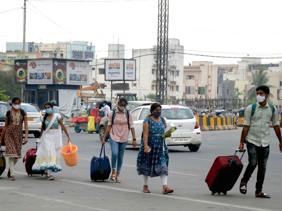 People moving to their own villages for fear of curfew Photo Gallery - Sakshi27