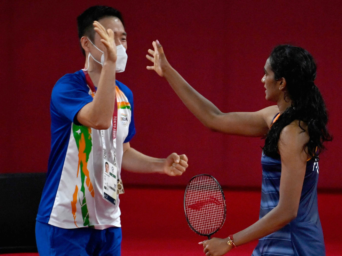 PV Sindhu becomes first Indian shuttler to reach two Olympic semis Photo Gallery - Sakshi11