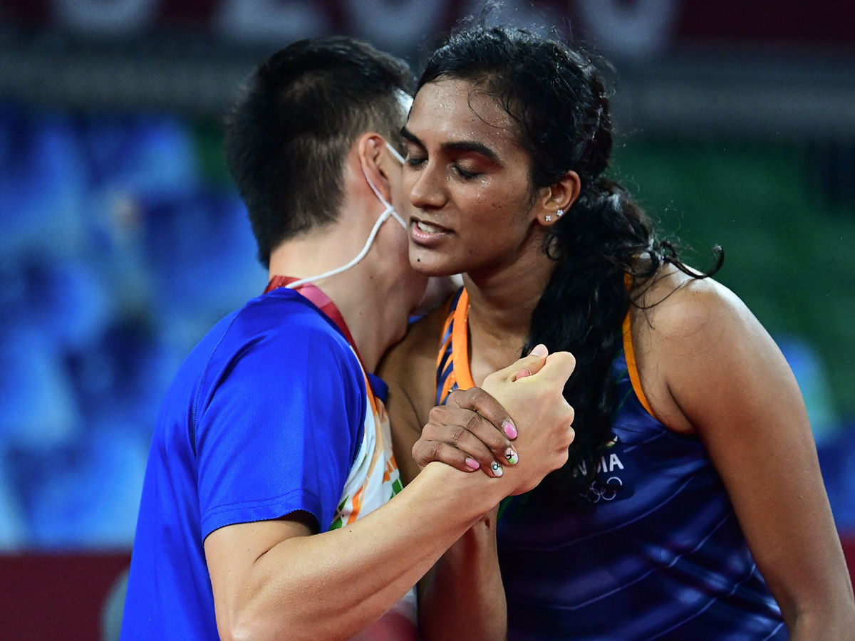 PV Sindhu becomes first Indian shuttler to reach two Olympic semis Photo Gallery - Sakshi12