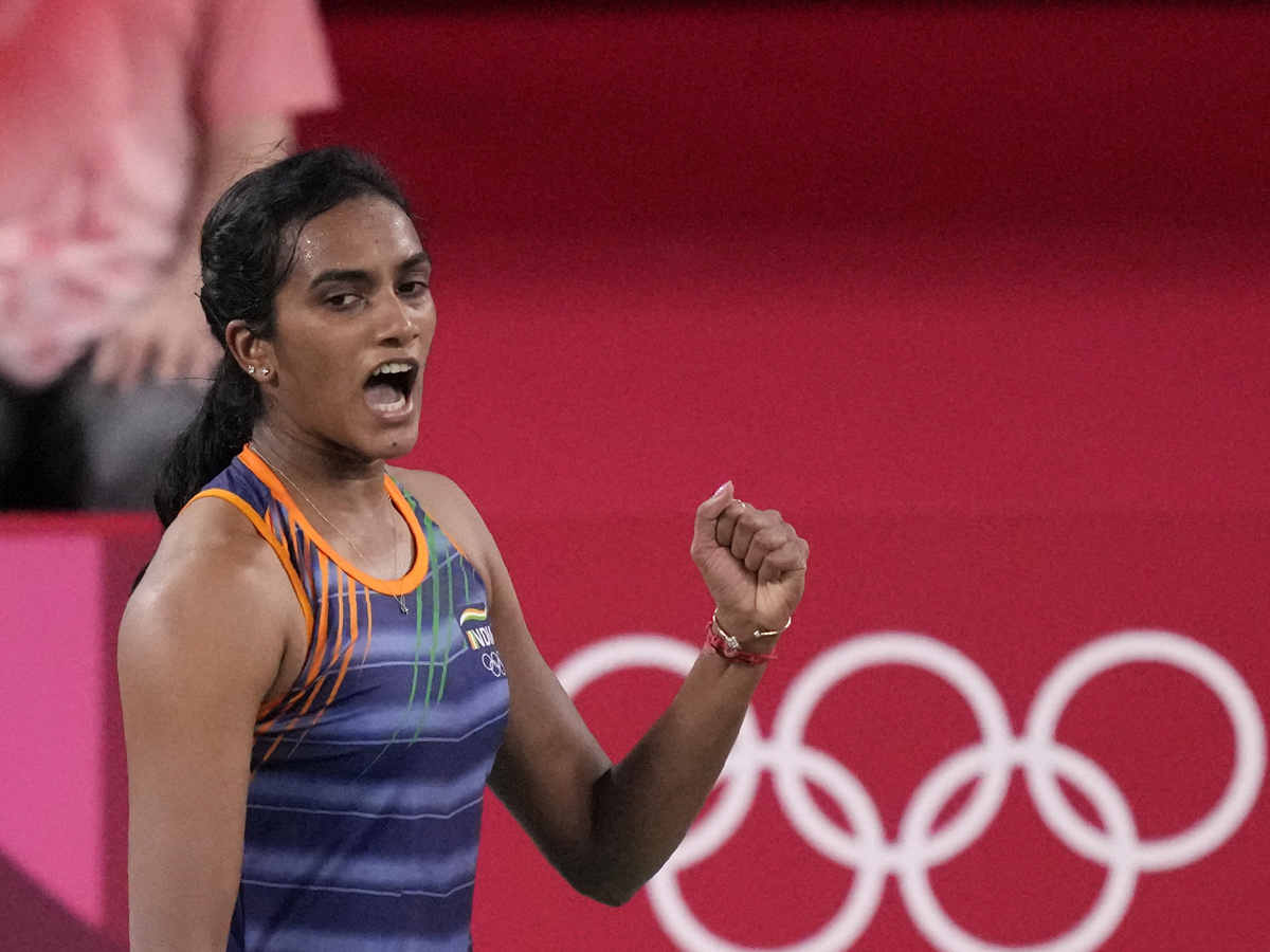 PV Sindhu becomes first Indian shuttler to reach two Olympic semis Photo Gallery - Sakshi1