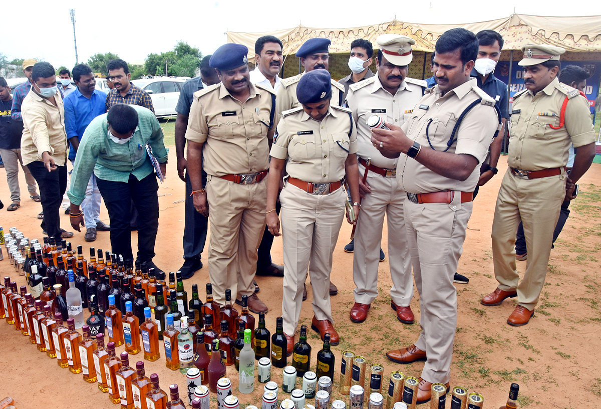 Liquor Bottles Crushed By Road Roller In Nellore - Sakshi29