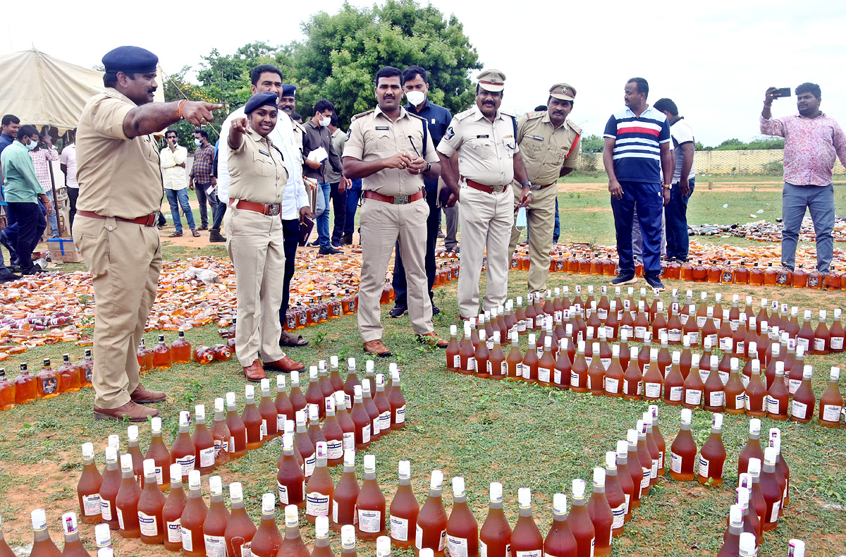 Liquor Bottles Crushed By Road Roller In Nellore - Sakshi2