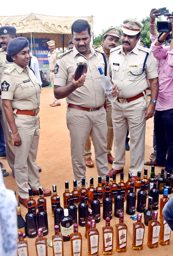 Liquor Bottles Crushed By Road Roller In Nellore - Sakshi3