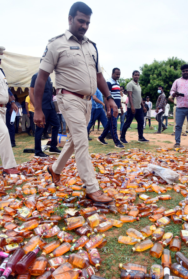 Liquor Bottles Crushed By Road Roller In Nellore - Sakshi4