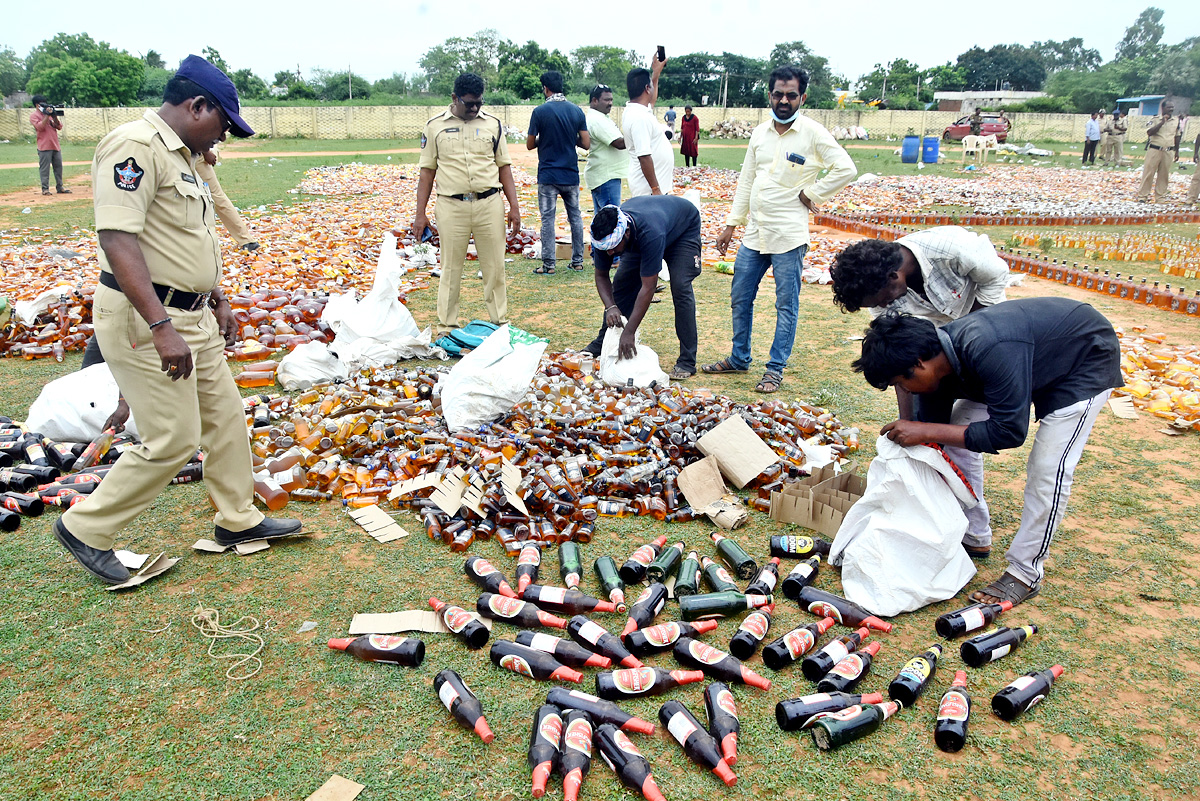 Liquor Bottles Crushed By Road Roller In Nellore - Sakshi6