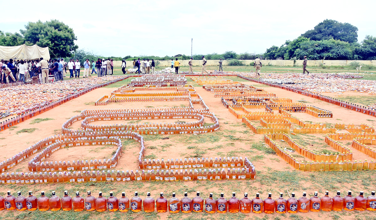 Liquor Bottles Crushed By Road Roller In Nellore - Sakshi9