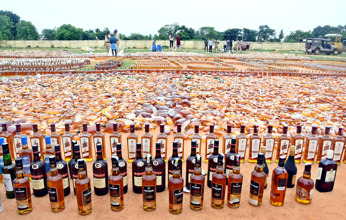 Liquor Bottles Crushed By Road Roller In Nellore - Sakshi10