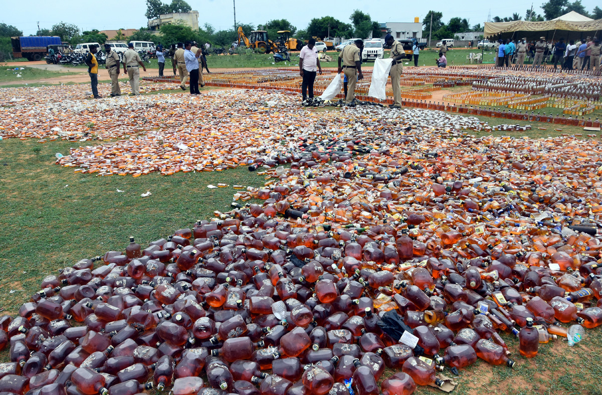 Liquor Bottles Crushed By Road Roller In Nellore - Sakshi11