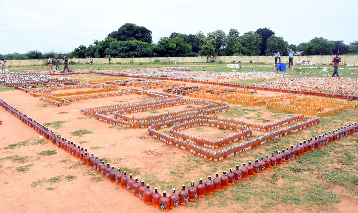 Liquor Bottles Crushed By Road Roller In Nellore - Sakshi12