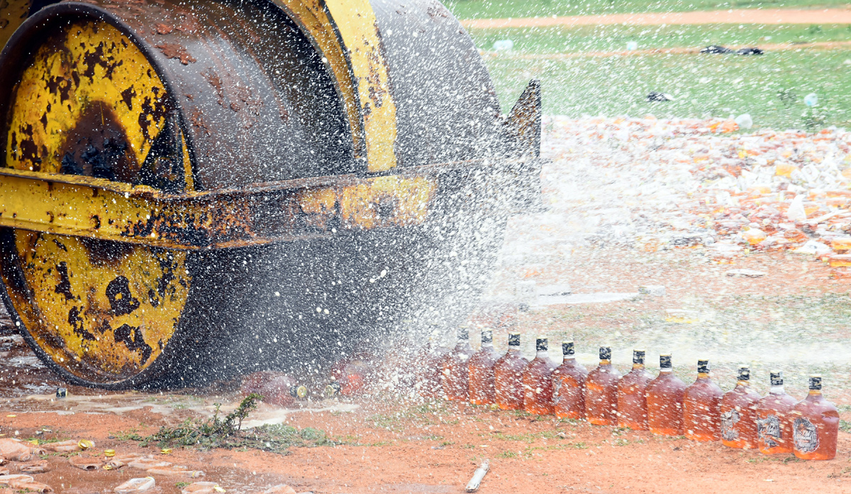 Liquor Bottles Crushed By Road Roller In Nellore - Sakshi20