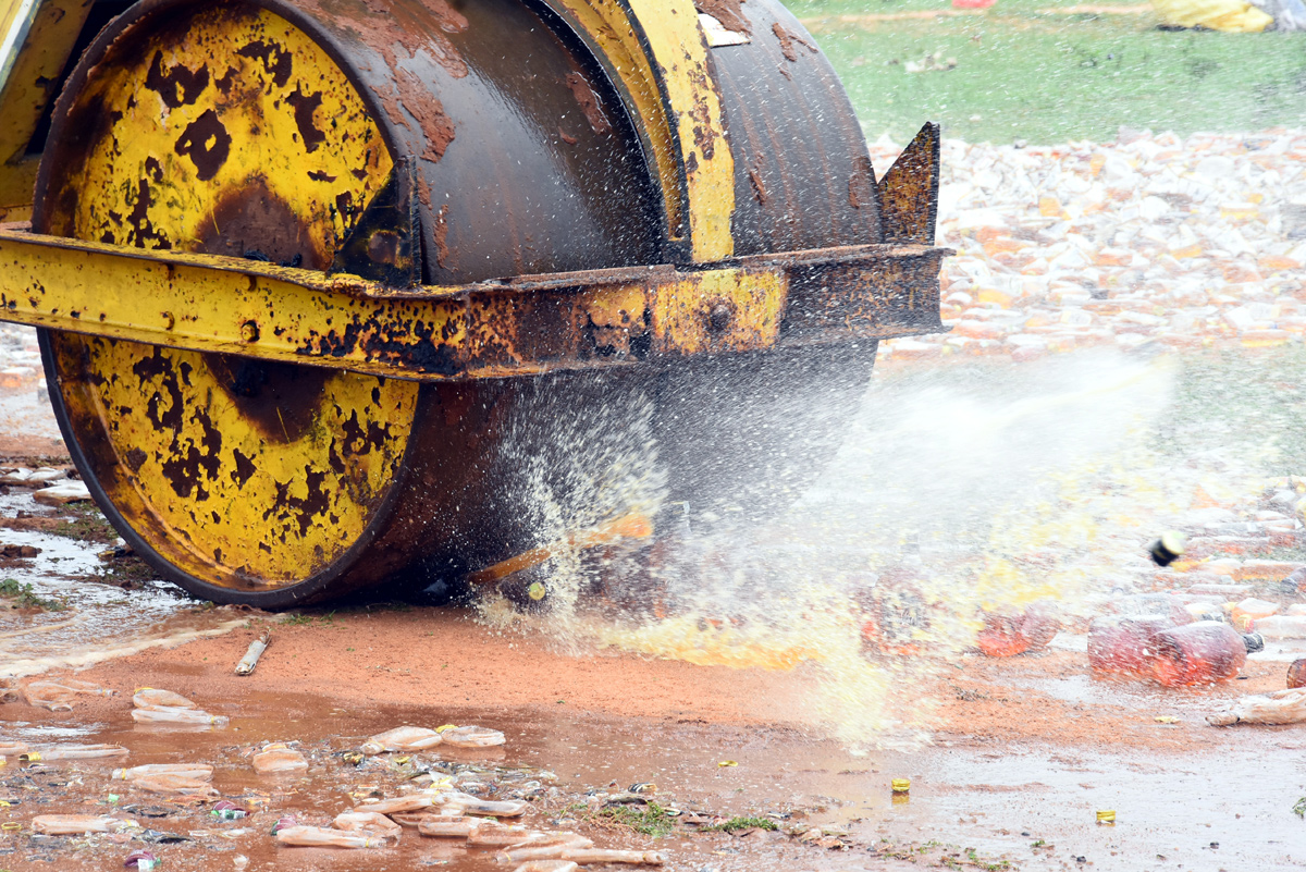 Liquor Bottles Crushed By Road Roller In Nellore - Sakshi22