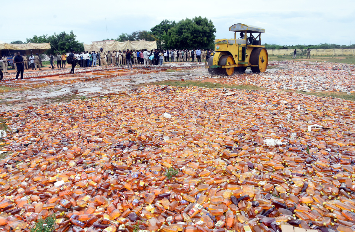 Liquor Bottles Crushed By Road Roller In Nellore - Sakshi23