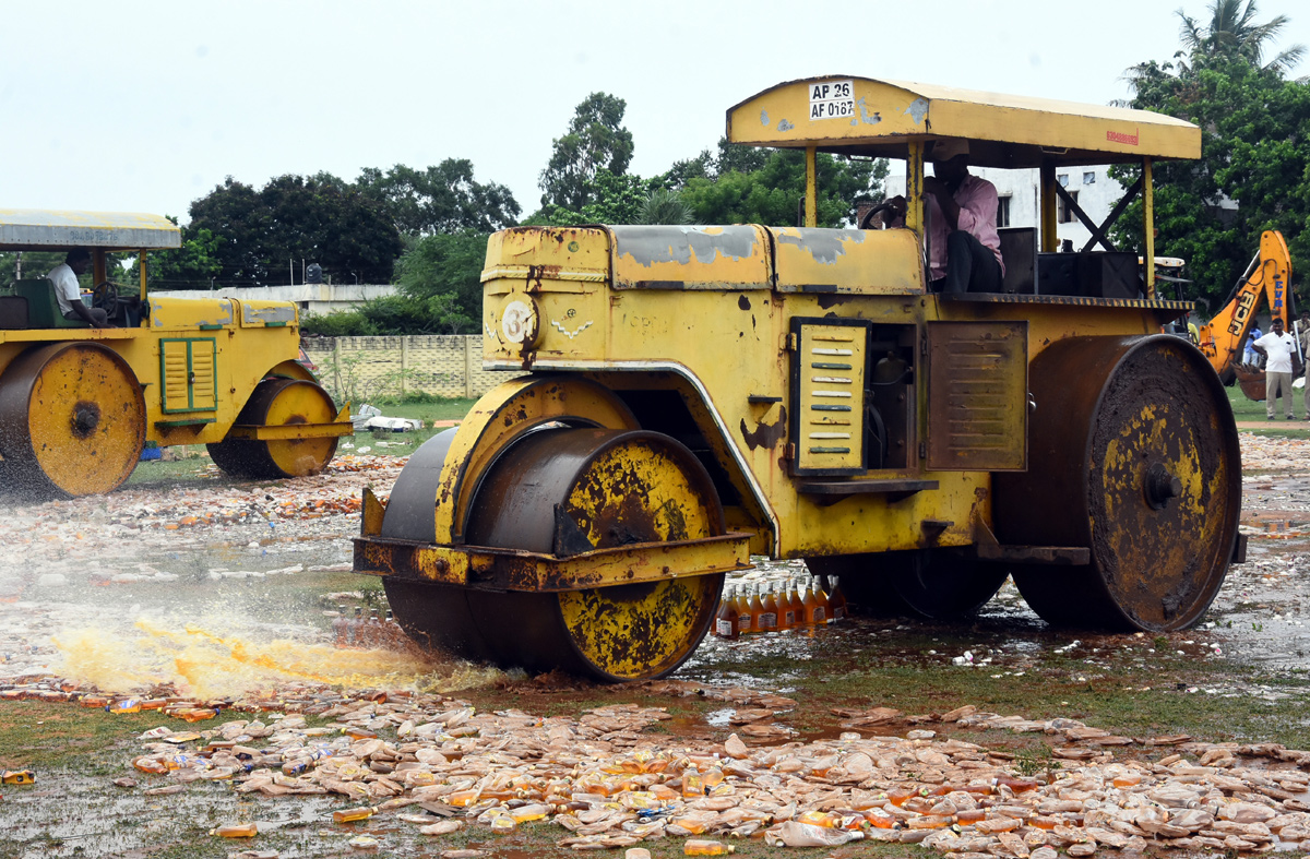 Liquor Bottles Crushed By Road Roller In Nellore - Sakshi28