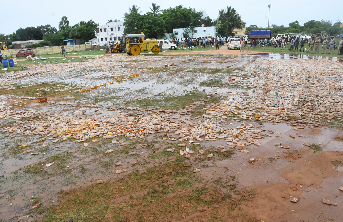 Liquor Bottles Crushed By Road Roller In Nellore - Sakshi32