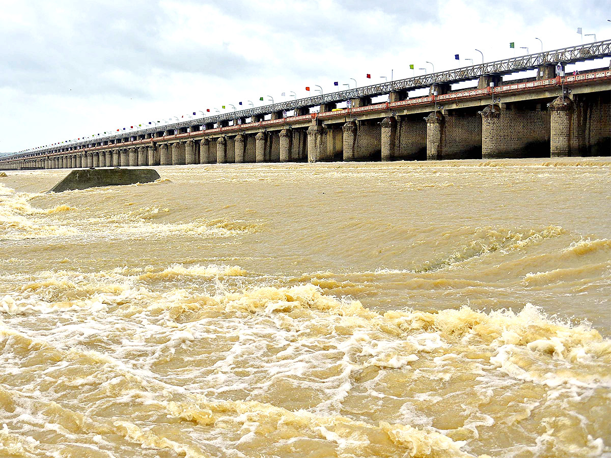 Huge Flood hit In Prakasam Barrage  - Sakshi12