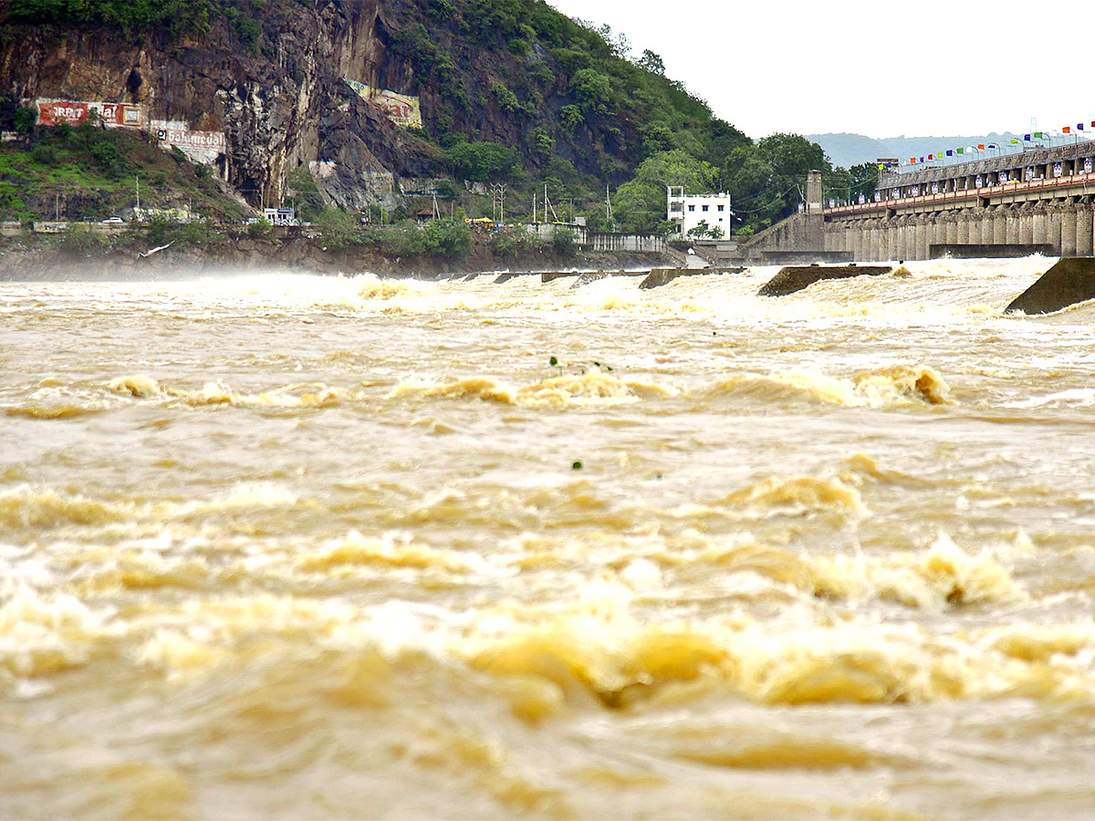 Huge Flood hit In Prakasam Barrage  - Sakshi2