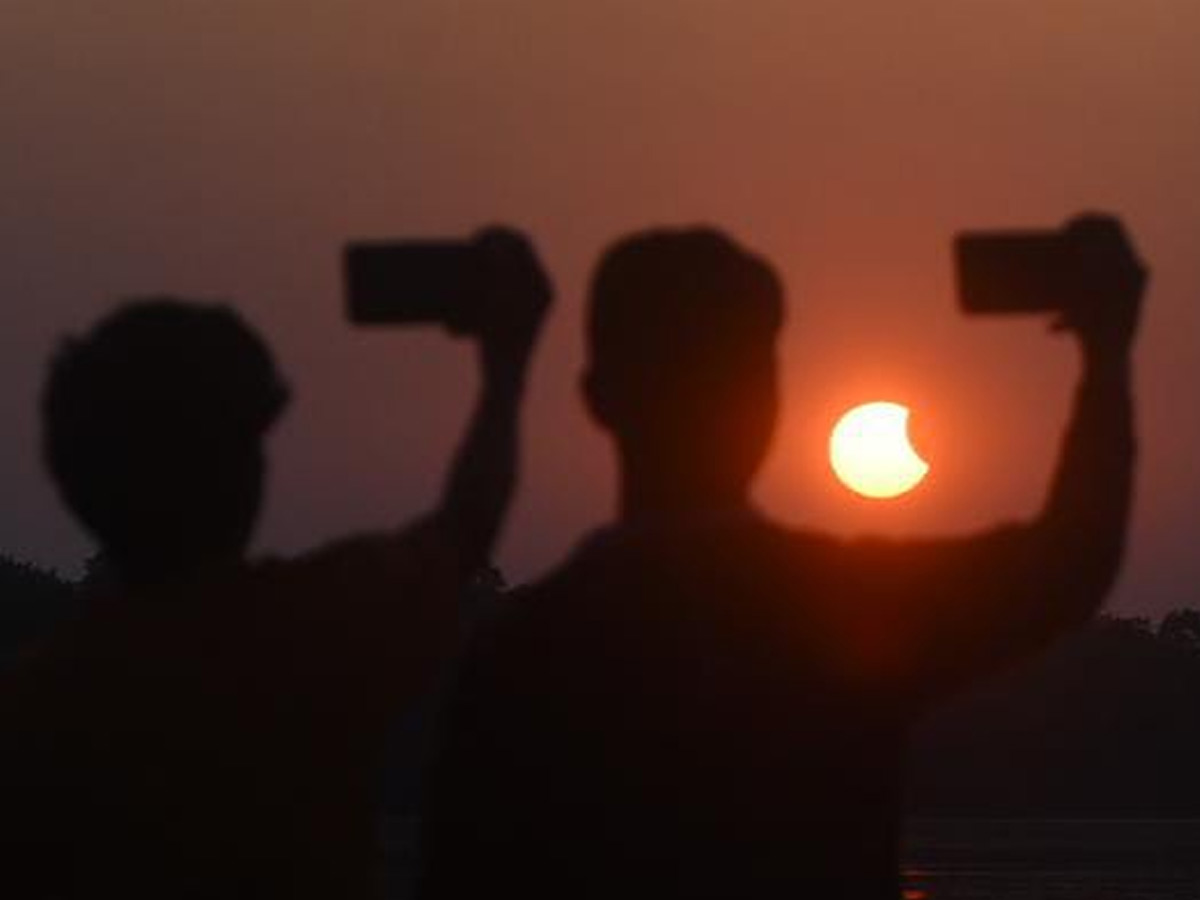 People observing solar eclipse Photo Gallery - Sakshi5