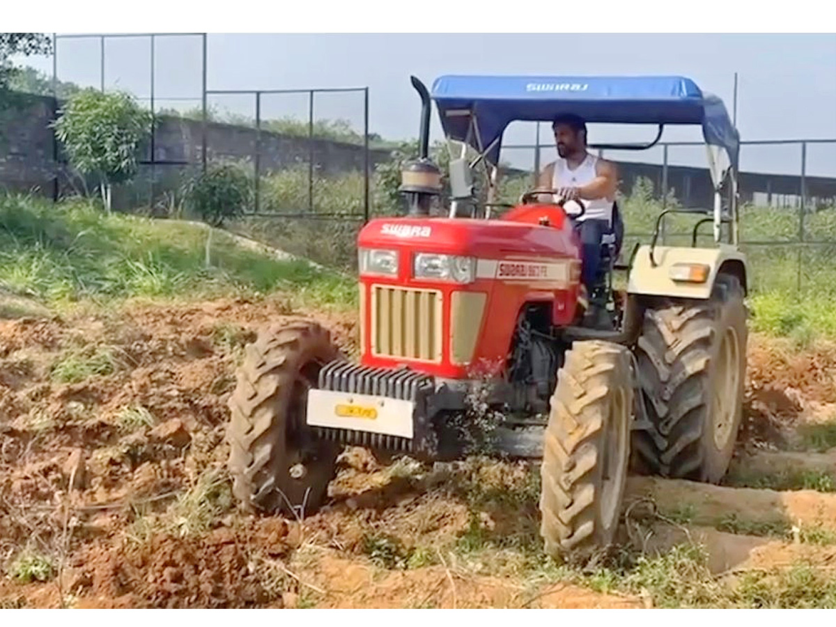 Dhoni Driving tractor while farming Photos - Sakshi2