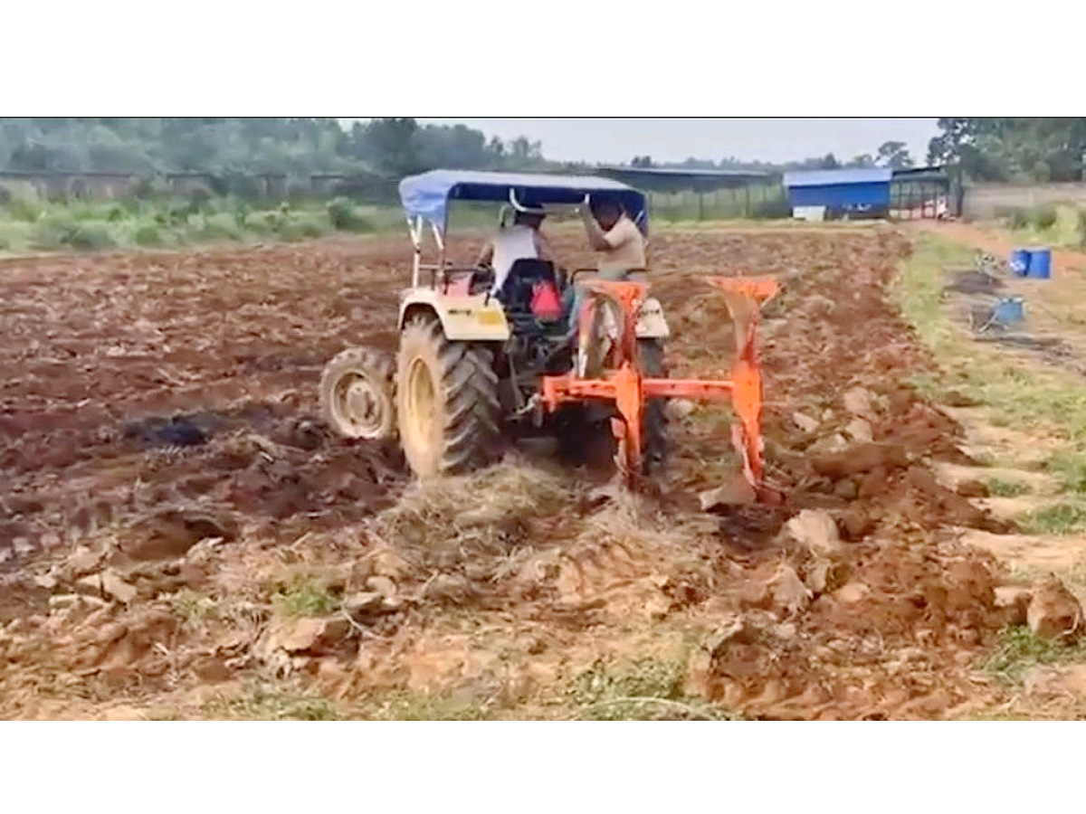 Dhoni Driving tractor while farming Photos - Sakshi4