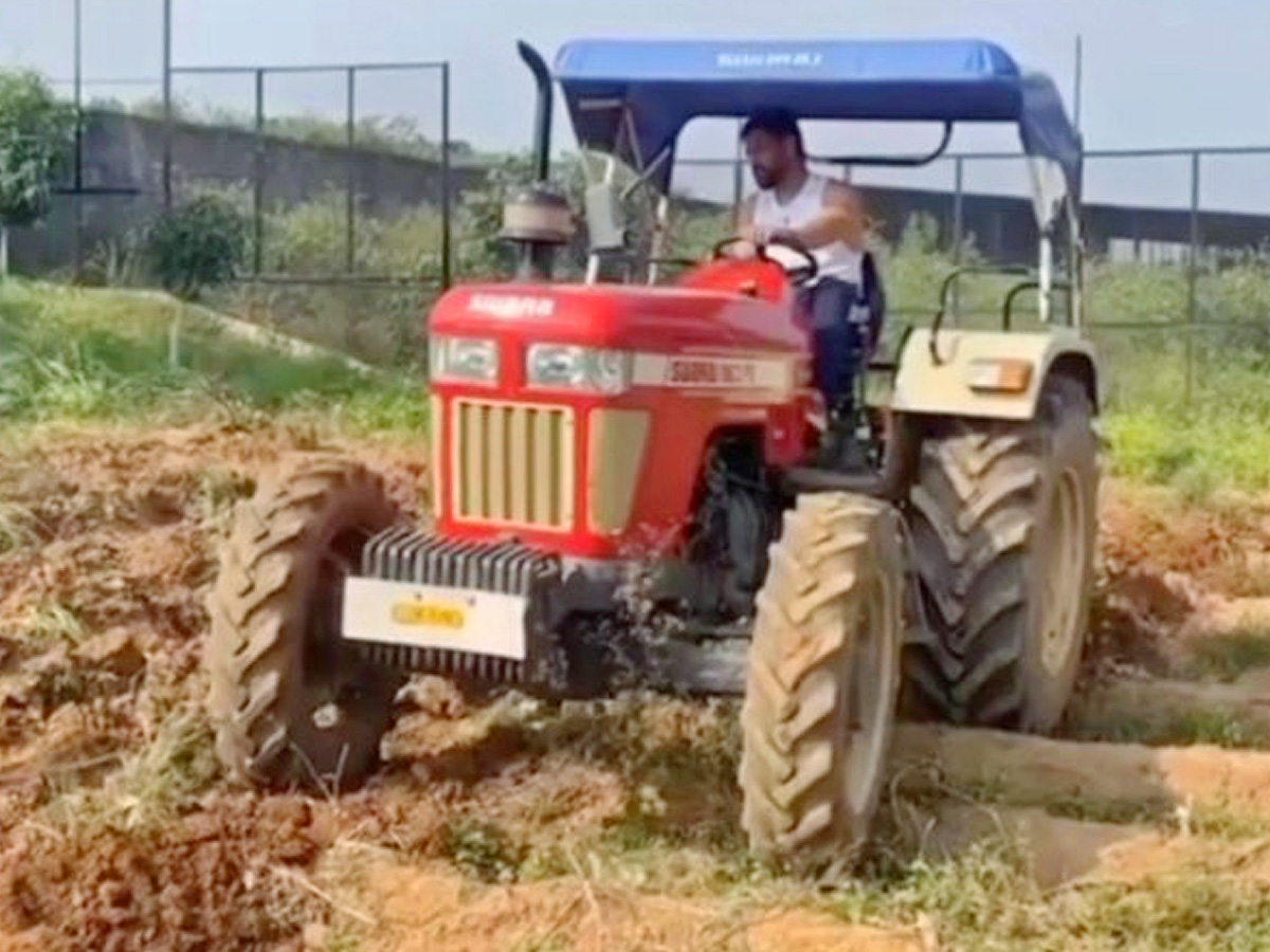 Dhoni Driving tractor while farming Photos - Sakshi6