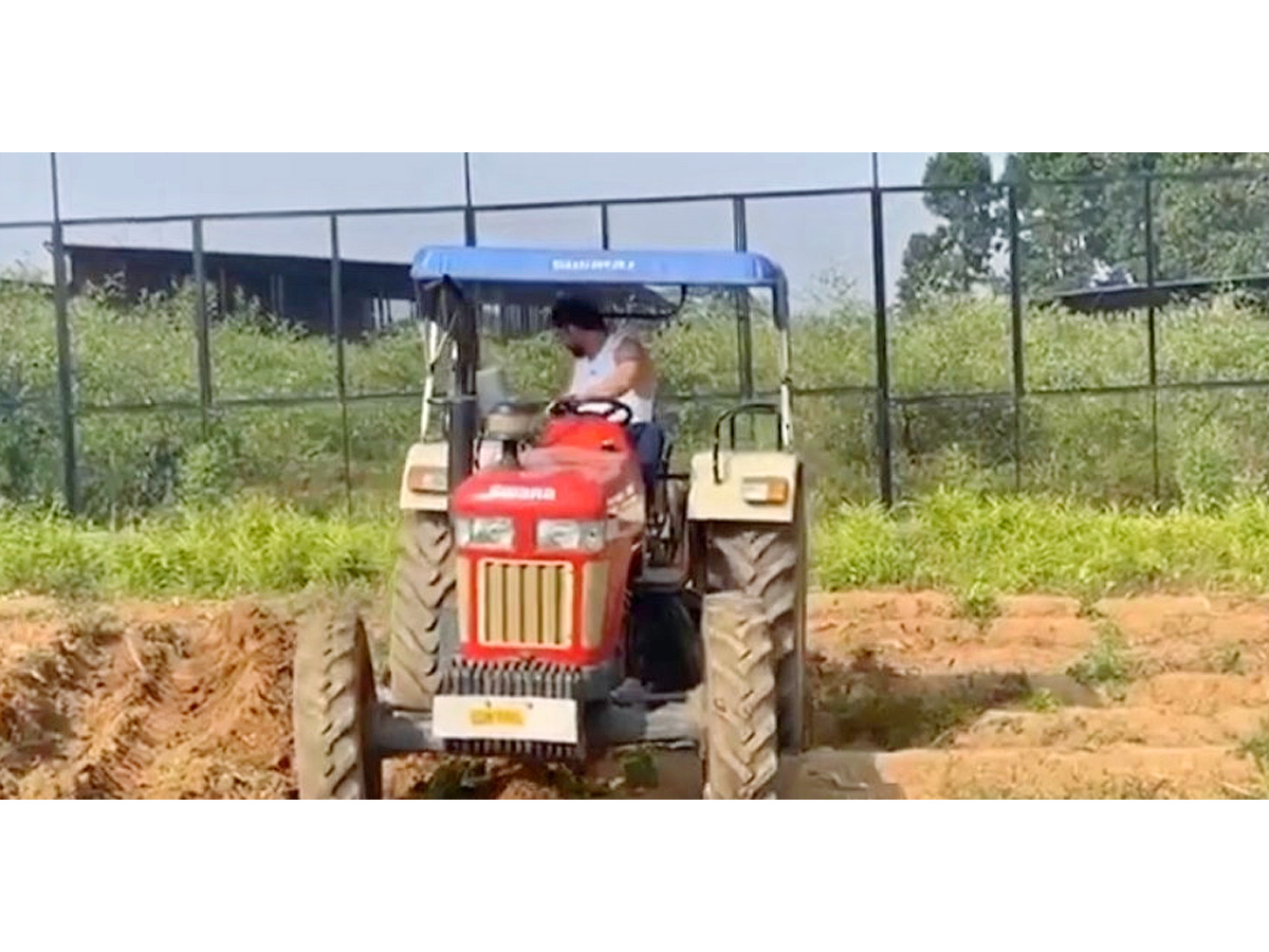 Dhoni Driving tractor while farming Photos - Sakshi7