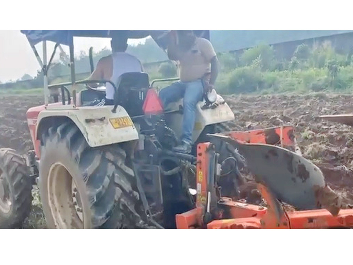 Dhoni Driving tractor while farming Photos - Sakshi8