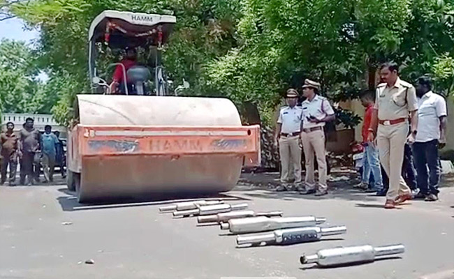 Police Crushing Bike Silencers Using Road Roller - Sakshi15