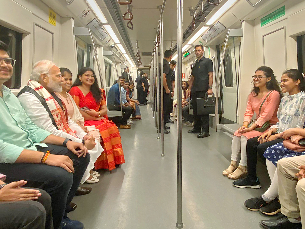 PM Narendra modi travels in metro to attend Delhi University event PHotos - Sakshi12