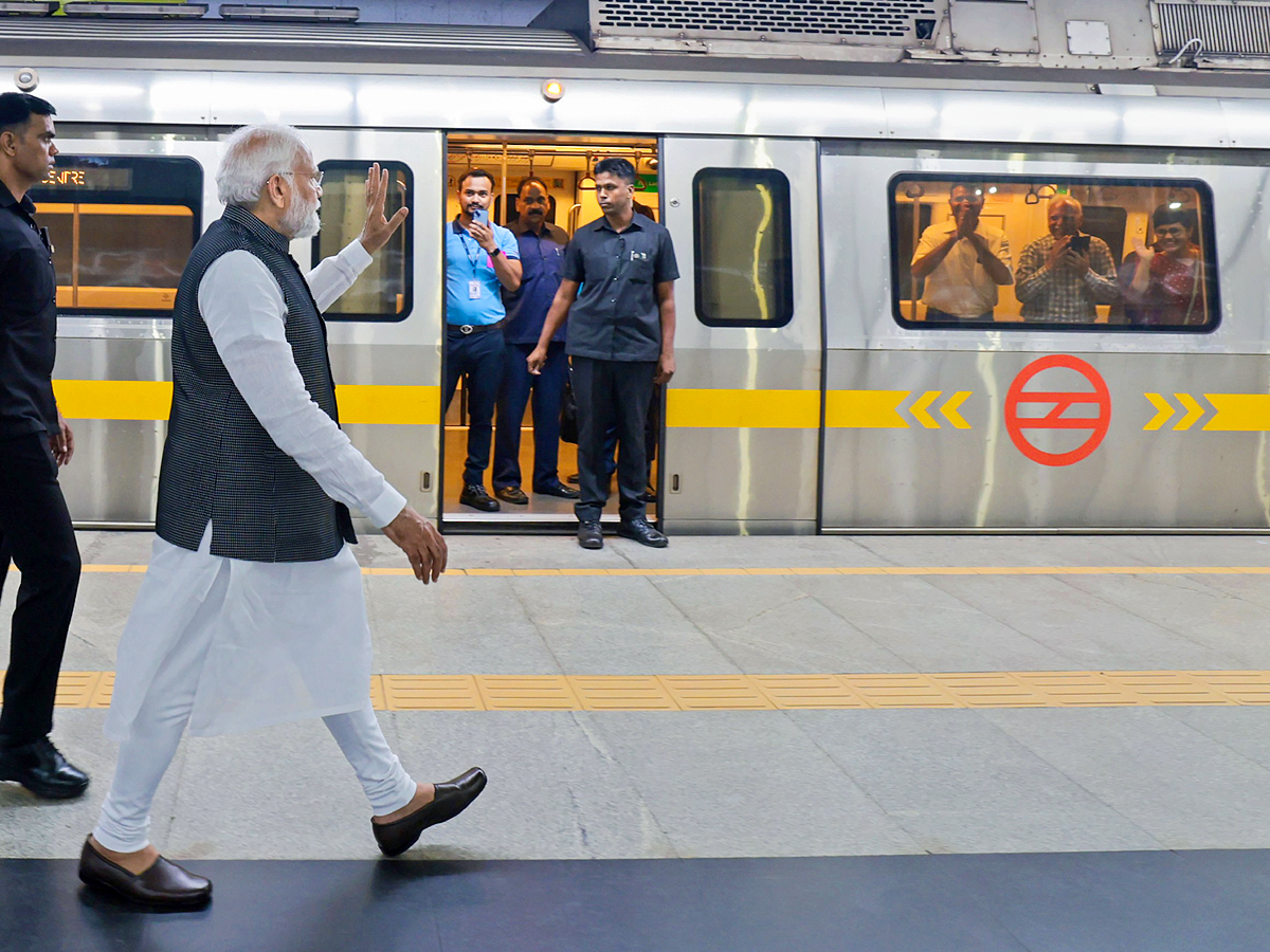 PM Narendra modi travels in metro to attend Delhi University event PHotos - Sakshi3