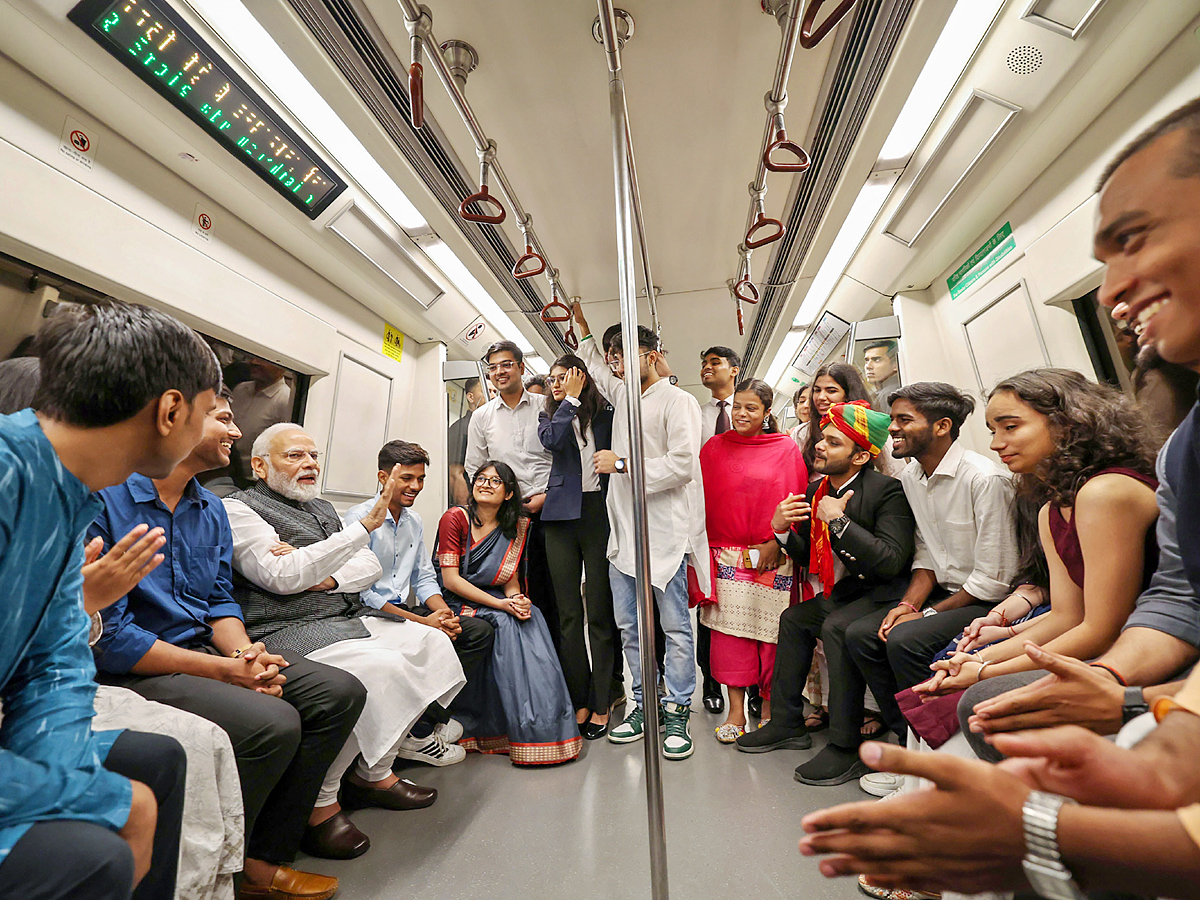 PM Narendra modi travels in metro to attend Delhi University event PHotos - Sakshi5