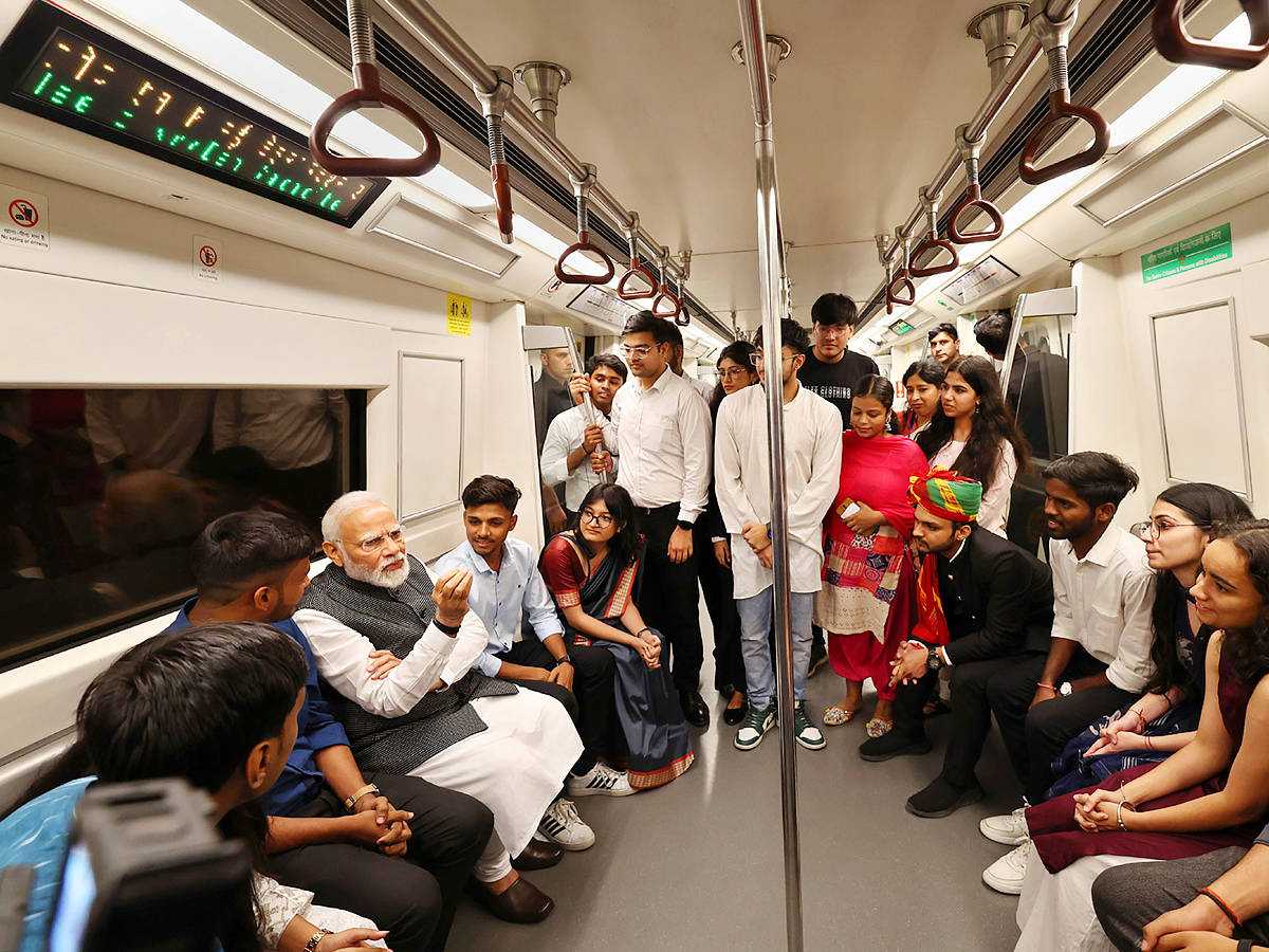 PM Narendra modi travels in metro to attend Delhi University event PHotos - Sakshi9