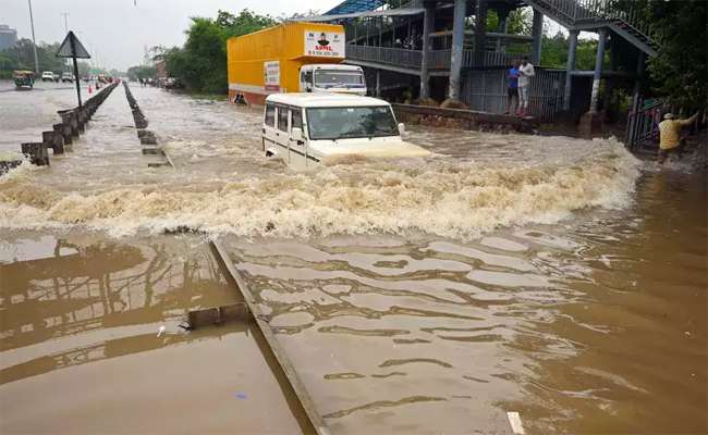 Heavy Rainfall Lashes Northern India Photo Gallery - Sakshi14