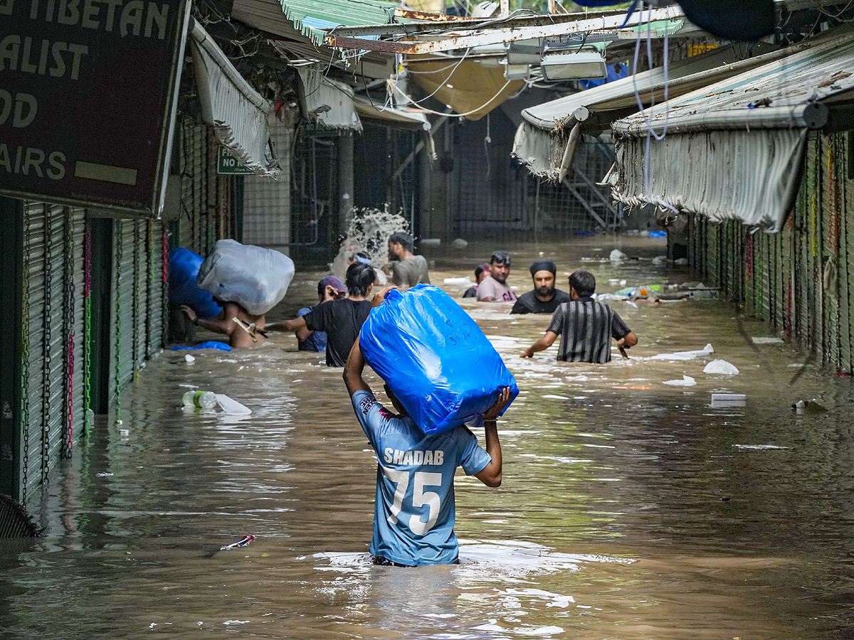 Yamuna Breaches Danger Level Waterlogging in Parts of Delhi Photos - Sakshi12